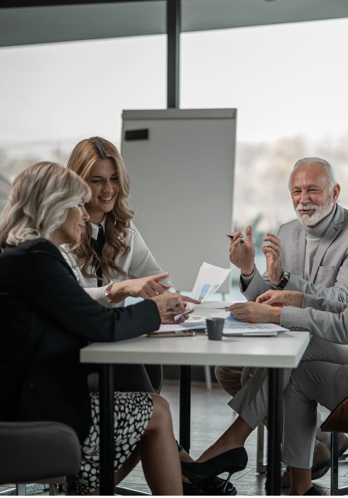 Group of business people on meeting, discussing with some chart examples